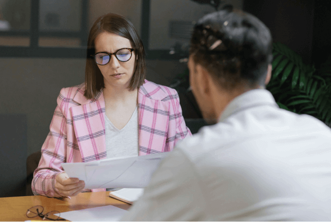 Pastor or ministry leader conducting a professional performance or counseling review session with a staff member.