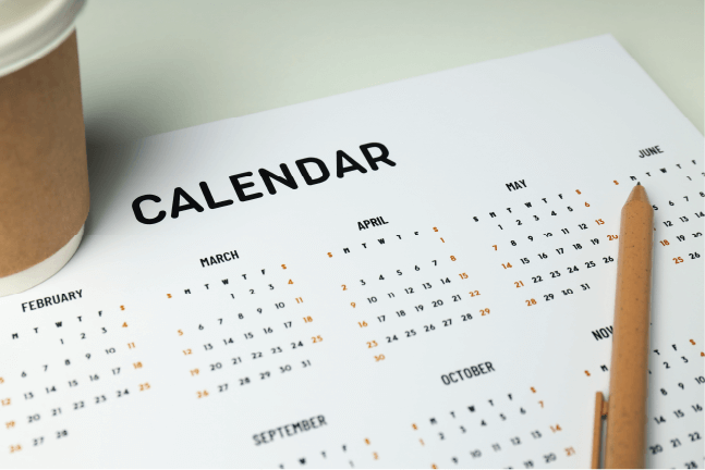 Printed calendar sheet layout with a wooden pencil, highlighting risk management for planning church events.