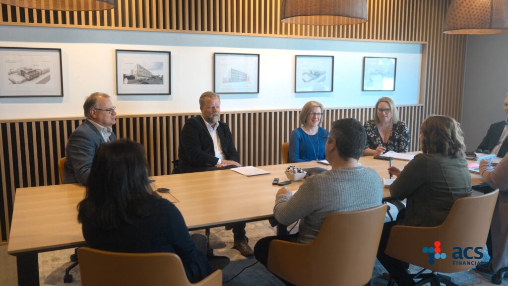 Board of directors reviewing long-term strategic plans and asset structures in an executive boardroom meeting.